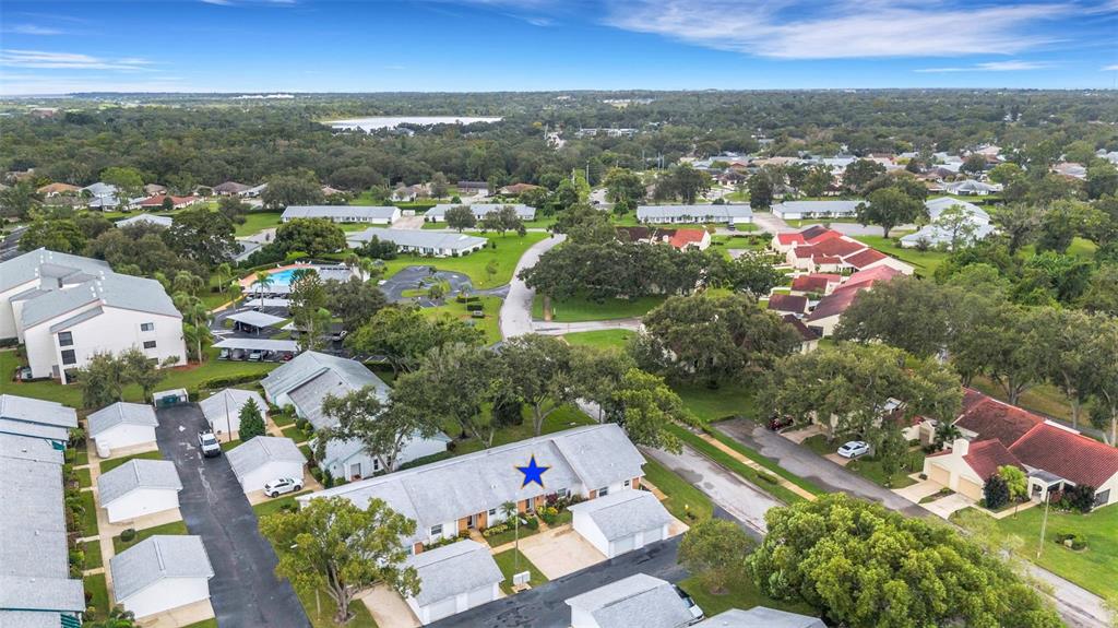 1065 Tartan Drive, Unit C Palm Harbor, FL 34684 - Photo 46 of 91 an aerial view of residential houses with city view