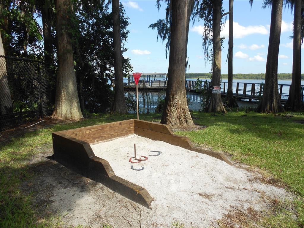 1065 Tartan Drive, Unit C Palm Harbor, FL 34684 - Photo 56 of 91 a view of a backyard with swimming pool