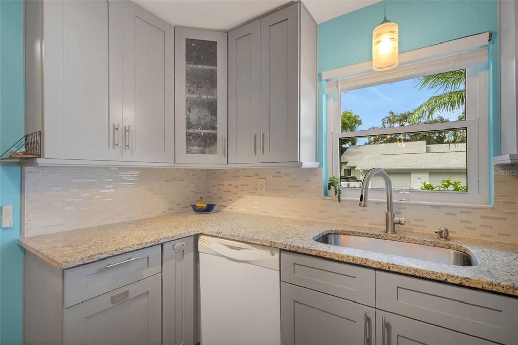 1065 Tartan Drive, Unit C Palm Harbor, FL 34684 - Photo 9 of 91 a kitchen with a sink cabinets and window