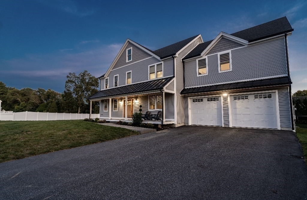 6 Rivendell Lane Millis, MA 02054 - Photo 2 of 33 a front view of a house with a yard