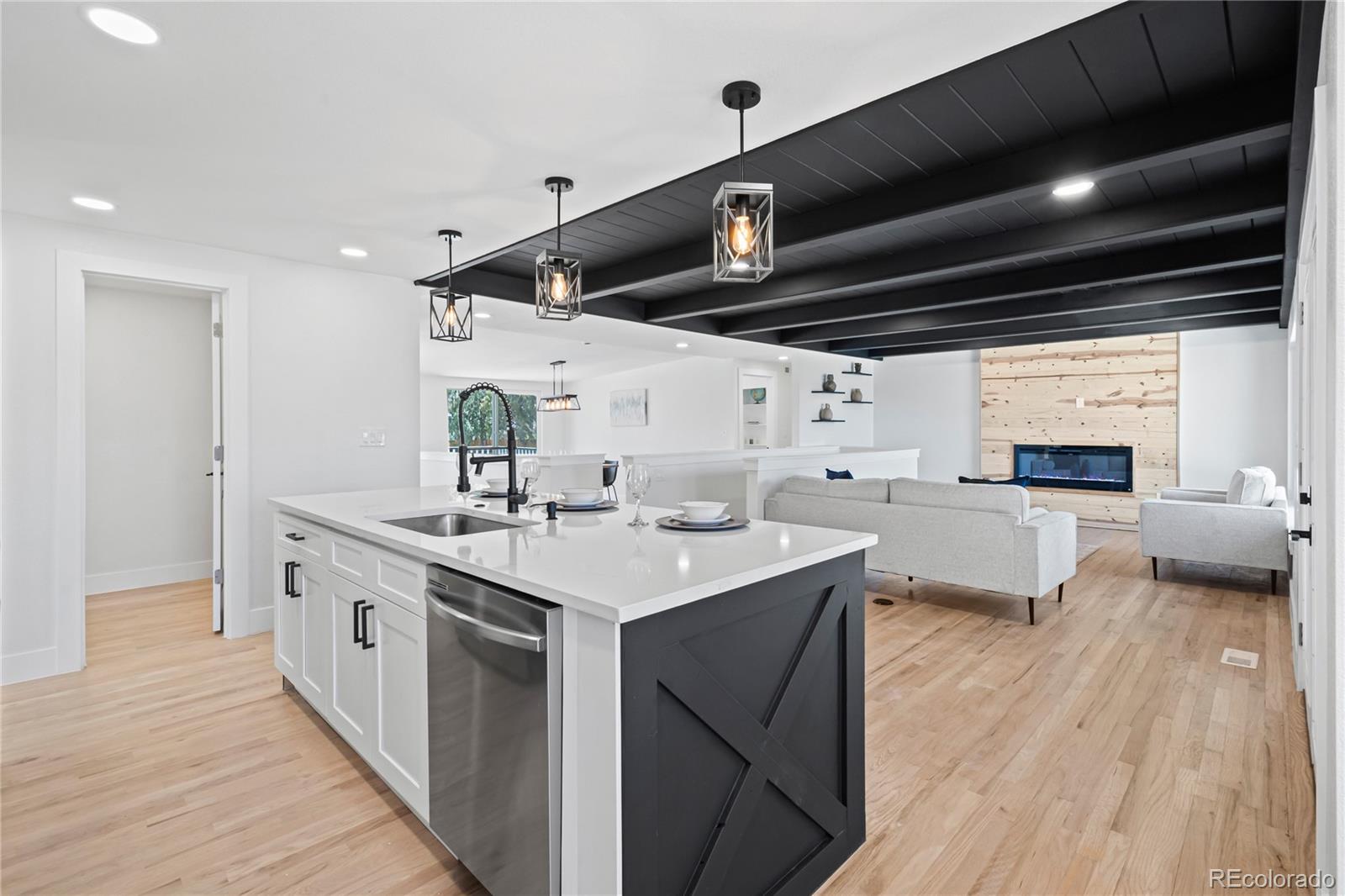 6766 Zenobia Loop Westminster, CO 80030 - Photo 14 of 50 a kitchen with cabinets a sink and appliances