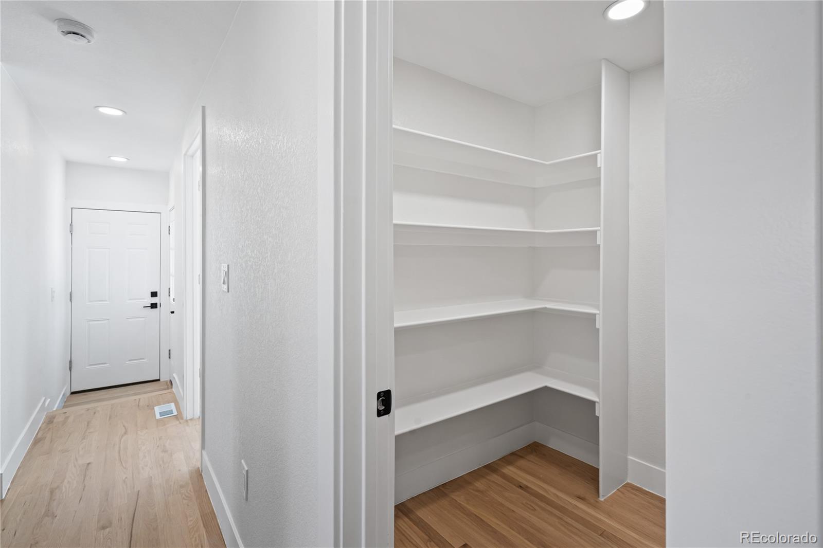 6766 Zenobia Loop Westminster, CO 80030 - Photo 17 of 50 a view of a room with wooden floor