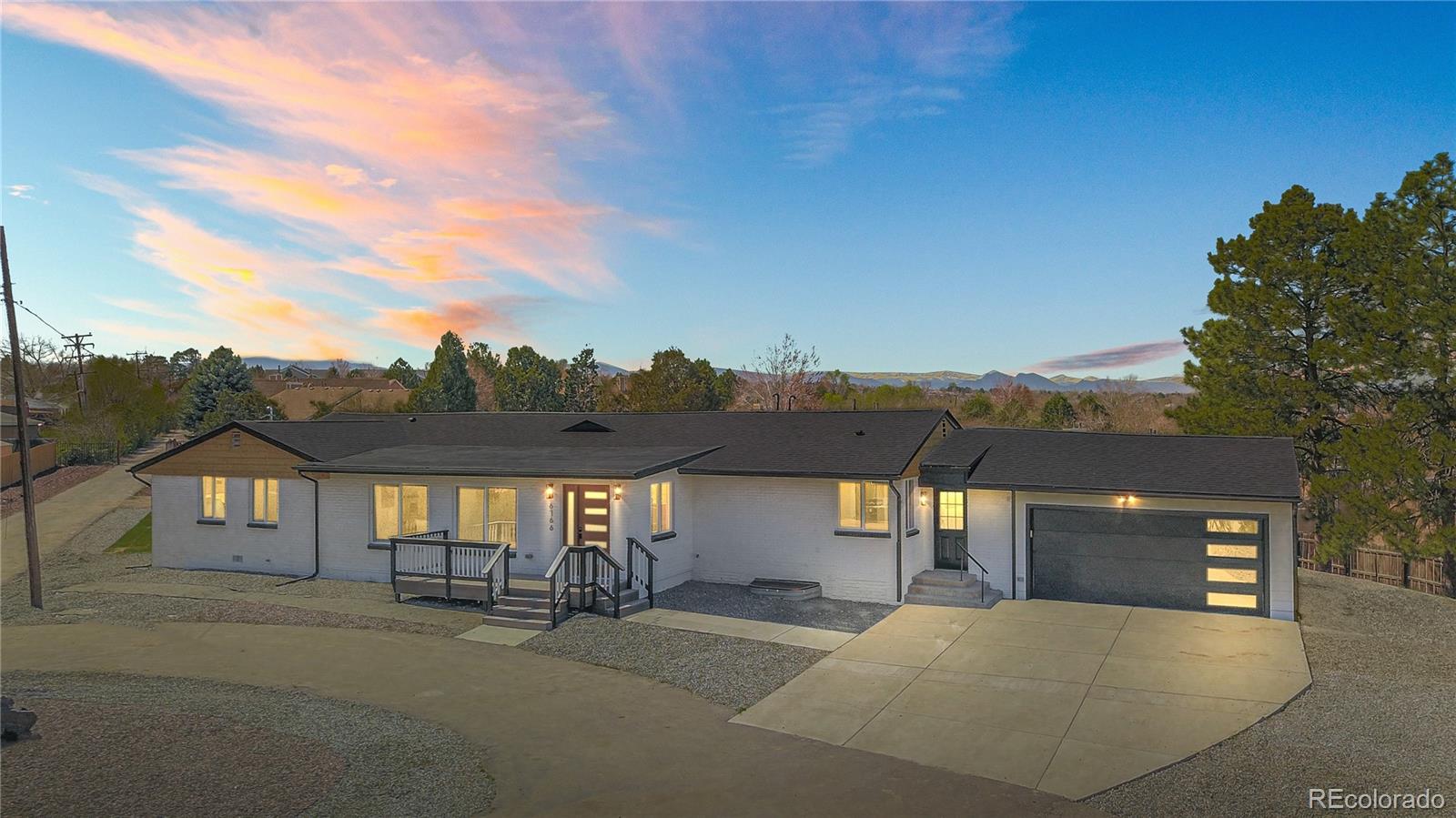 6766 Zenobia Loop Westminster, CO 80030 - Photo 2 of 50 a view of a house with a street
