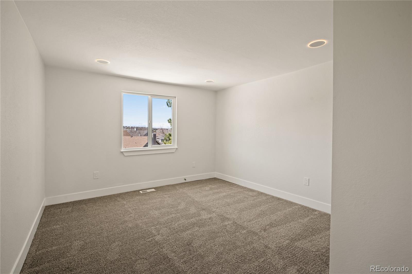 6766 Zenobia Loop Westminster, CO 80030 - Photo 22 of 50 an empty room with a window