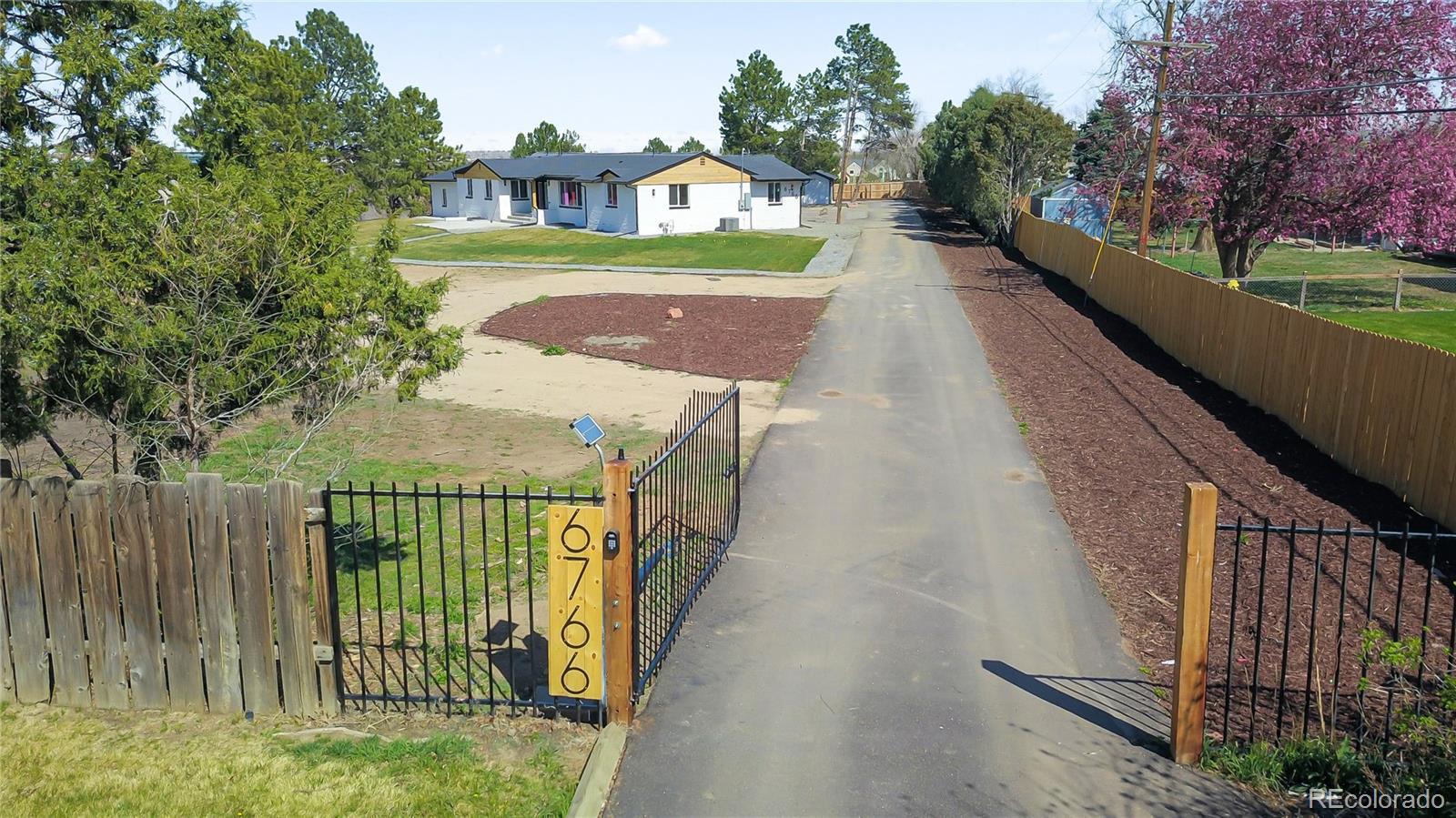 6766 Zenobia Loop Westminster, CO 80030 - Photo 3 of 50 a view of building with yard
