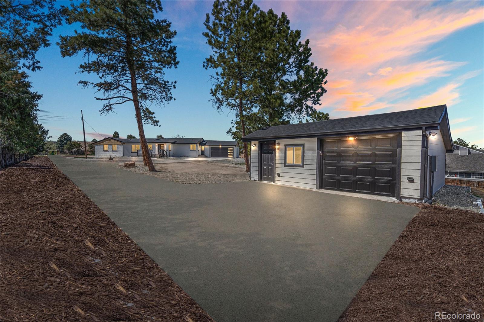 6766 Zenobia Loop Westminster, CO 80030 - Photo 46 of 50 a view of a house with backyard and trees
