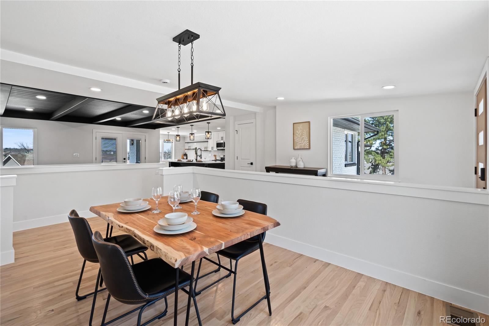 6766 Zenobia Loop Westminster, CO 80030 - Photo 8 of 50 a view of a dining room with furniture window and wooden floor
