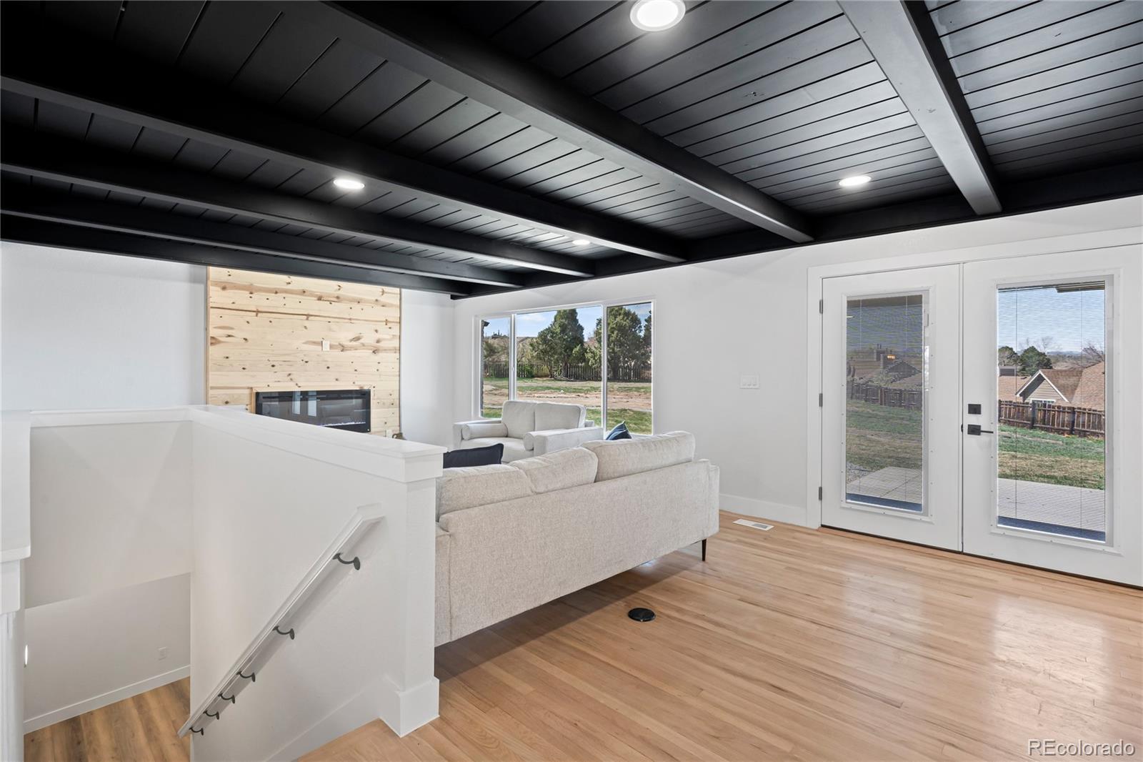 6766 Zenobia Loop Westminster, CO 80030 - Photo 9 of 50 a living room with furniture and windows