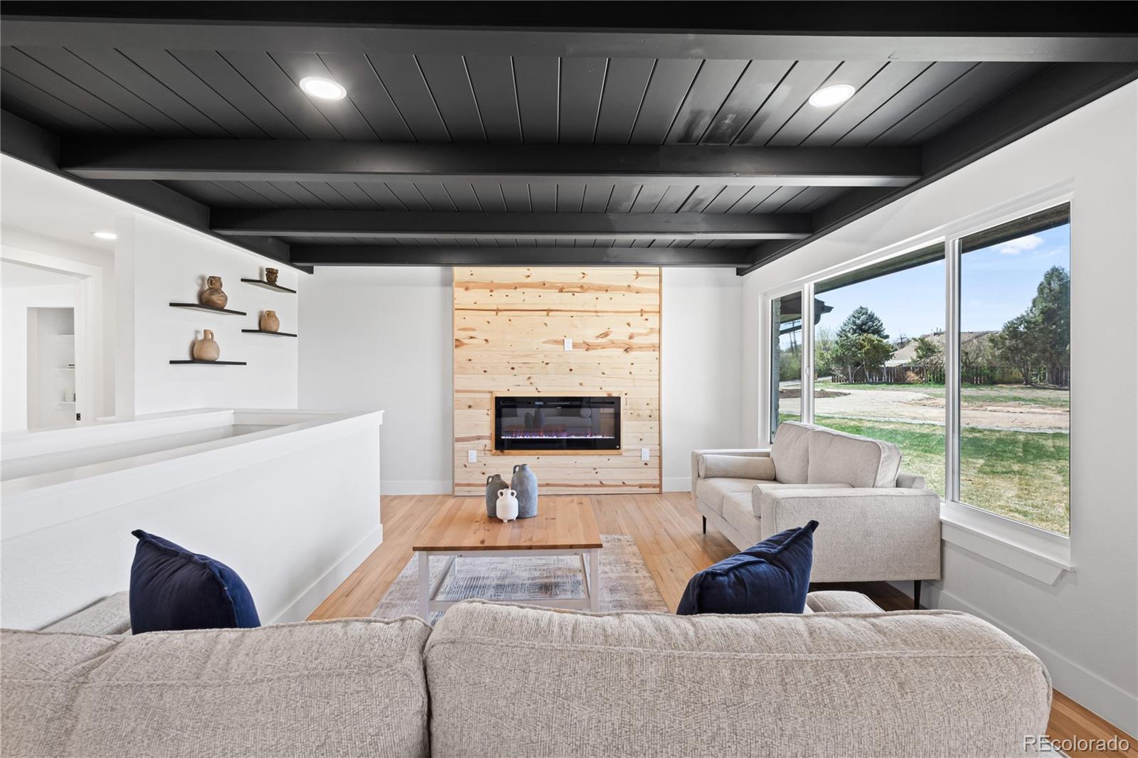 6766 Zenobia Loop Westminster, CO 80030 - Photo 10 of 50 a living room with furniture and a large window