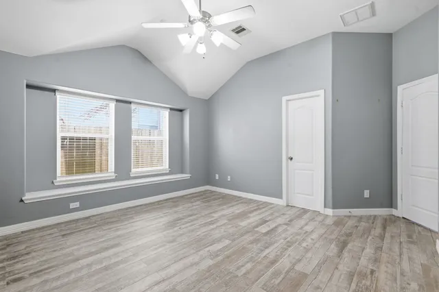 a bathroom with a sink a large mirror and a bathtub