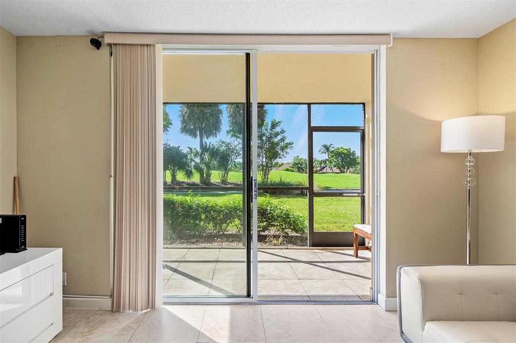 2440 DC Country Club Boulevard, Unit 111C Deerfield Beach, FL 33442 - Photo 12 of 43 a view of a room that has a bed and a window
