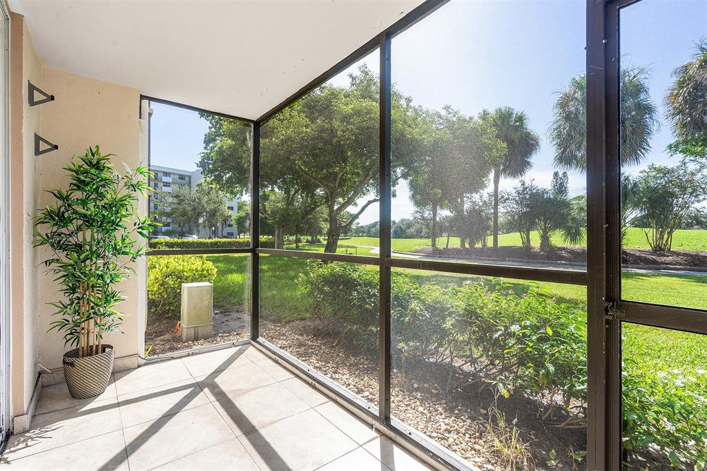 2440 DC Country Club Boulevard, Unit 111C Deerfield Beach, FL 33442 - Photo 22 of 43 a house view with a garden view