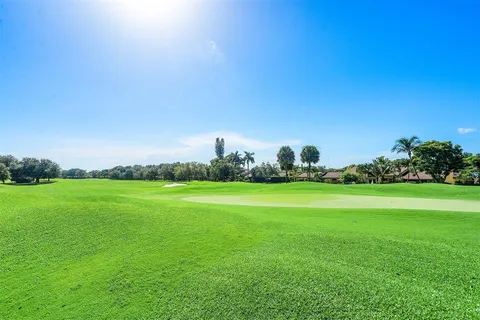 a view of a green field with clear sky