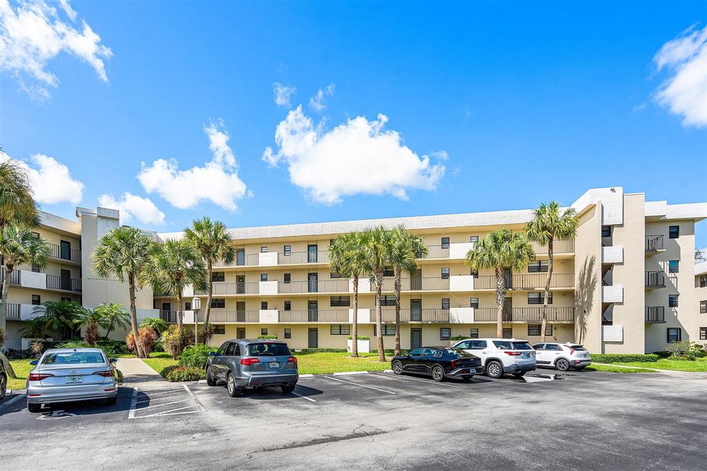 2440 DC Country Club Boulevard, Unit 111C Deerfield Beach, FL 33442 - Photo 31 of 43 a car parked in front of a building