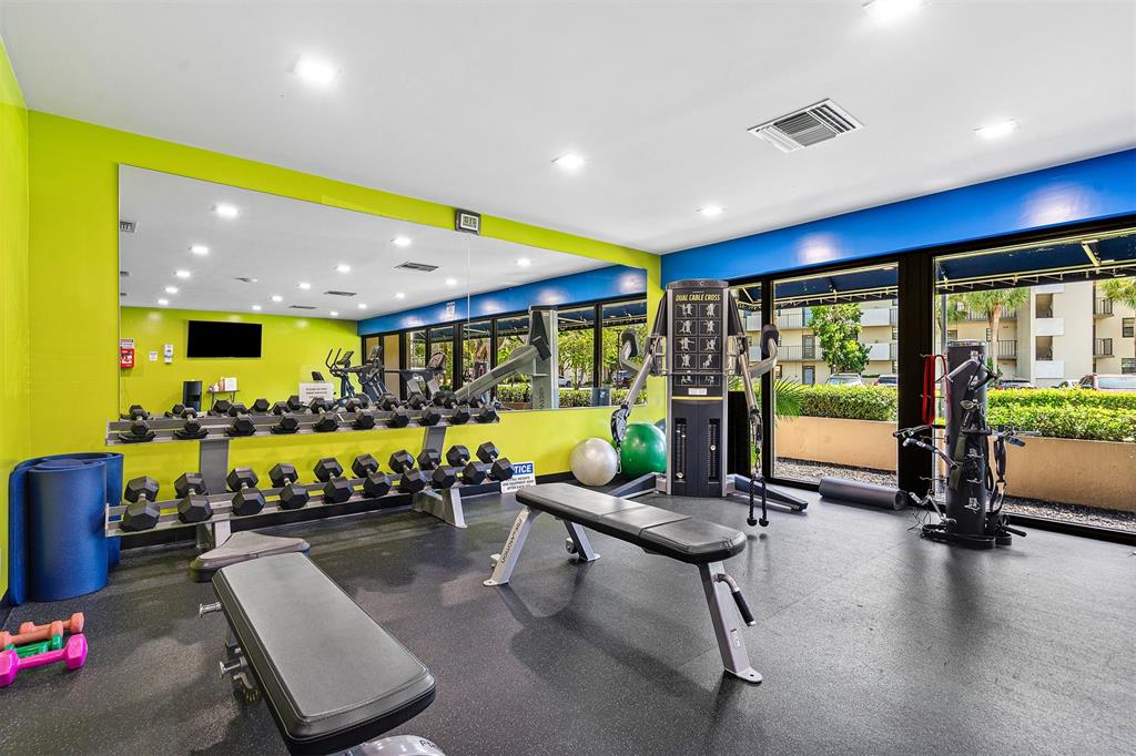 2440 DC Country Club Boulevard, Unit 111C Deerfield Beach, FL 33442 - Photo 37 of 43 a living room with furniture and a large window