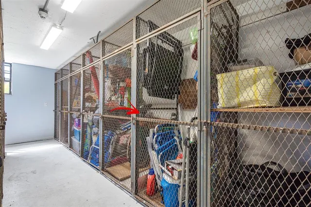 a view of walk in closet with clothes