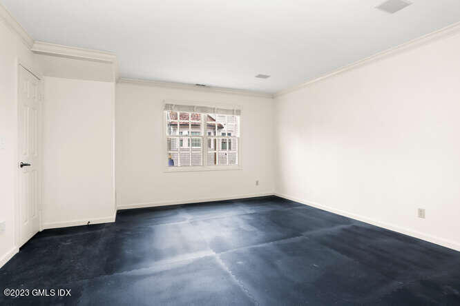28 Home Place, Unit B1 Greenwich, CT 06830 - Photo 16 of 22 an empty room with wooden floor and windows
