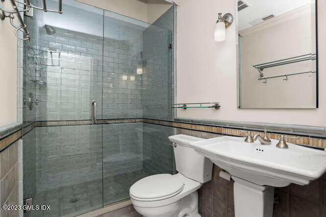 28 Home Place, Unit B1 Greenwich, CT 06830 - Photo 17 of 22 a bathroom with a sink a toilet and shower