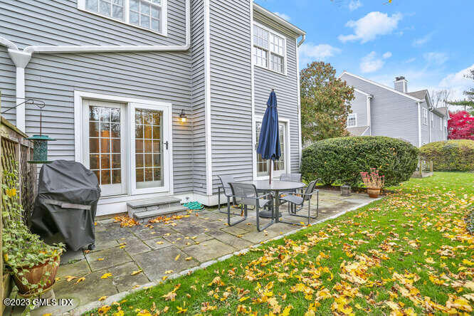 28 Home Place, Unit B1 Greenwich, CT 06830 - Photo 20 of 22 a front view of house with outdoor seating