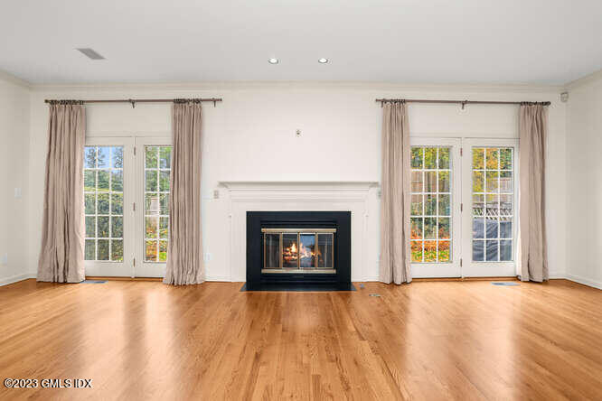 28 Home Place, Unit B1 Greenwich, CT 06830 - Photo 4 of 22 a view of an empty room with a fireplace and a window
