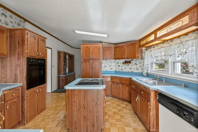 a kitchen with a stove and a sink