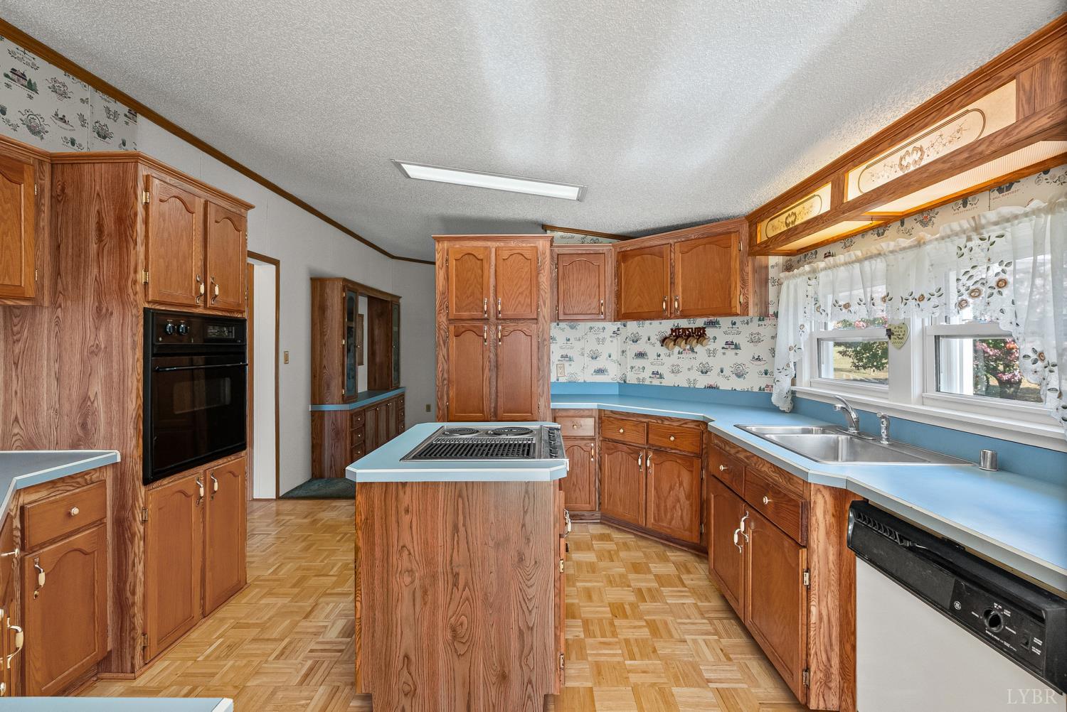1821 Telegraph Road Gretna, VA 24557 - Photo 12 of 54 a kitchen with stainless steel appliances granite countertop a sink and wooden cabinets