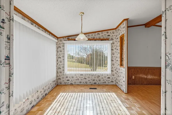 a view of a hallway with windows