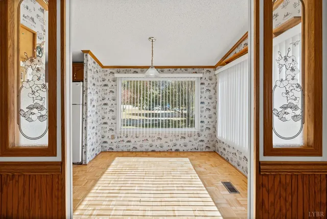 a view of a entryway with furniture and chandelier