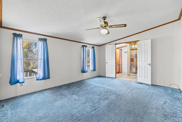 a view of empty room with windows