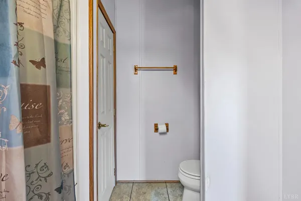 a close view of a refrigerator in kitchen and cabinets