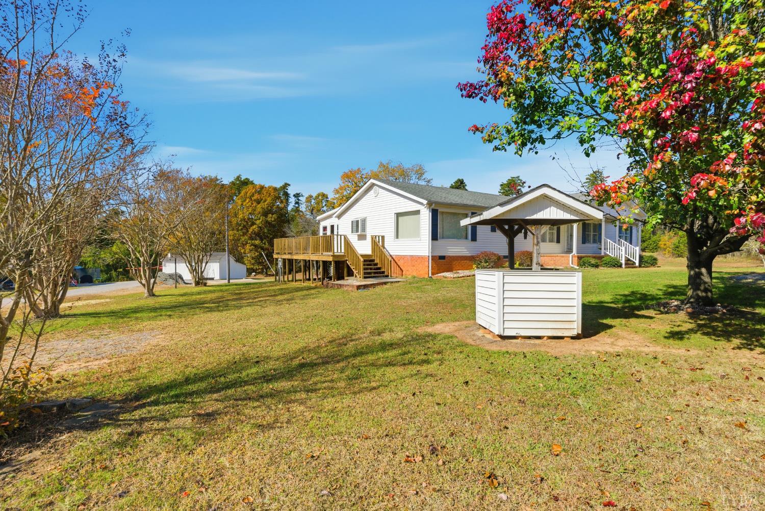 1821 Telegraph Road Gretna, VA 24557 - Photo 30 of 54 a front view of a house with a yard table and chairs