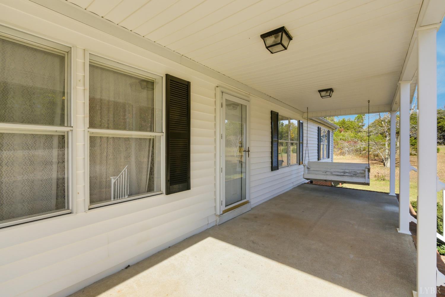 1821 Telegraph Road Gretna, VA 24557 - Photo 3 of 54 a view of an empty room with large windows