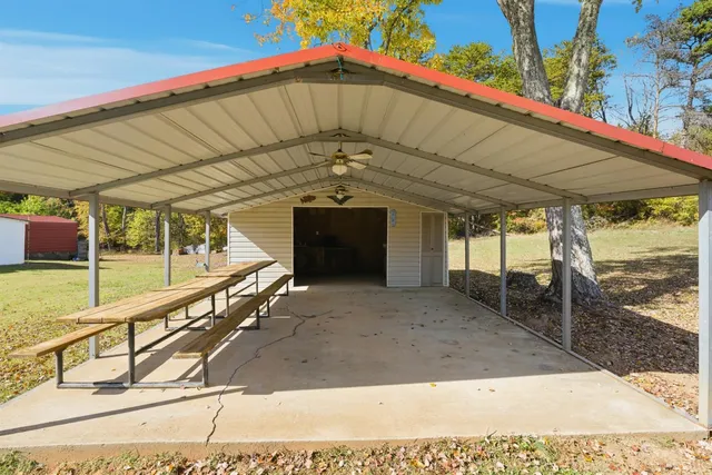 a kitchen with white cabinets and appliances