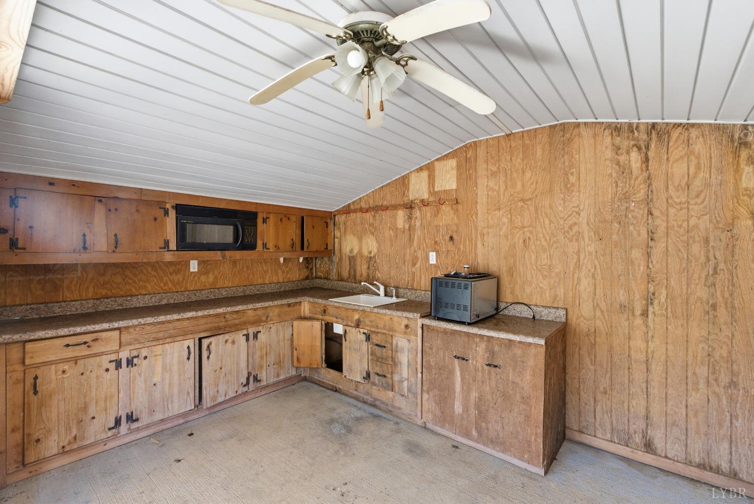 1821 Telegraph Road Gretna, VA 24557 - Photo 40 of 54 a kitchen with stainless steel appliances granite countertop a sink a stove and cabinets