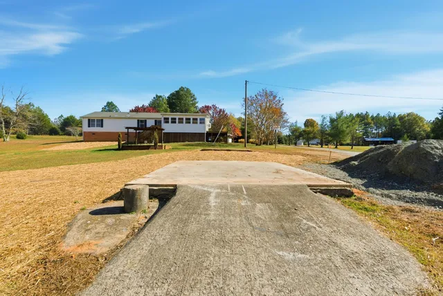 a view of a swimming pool with an outdoor seating