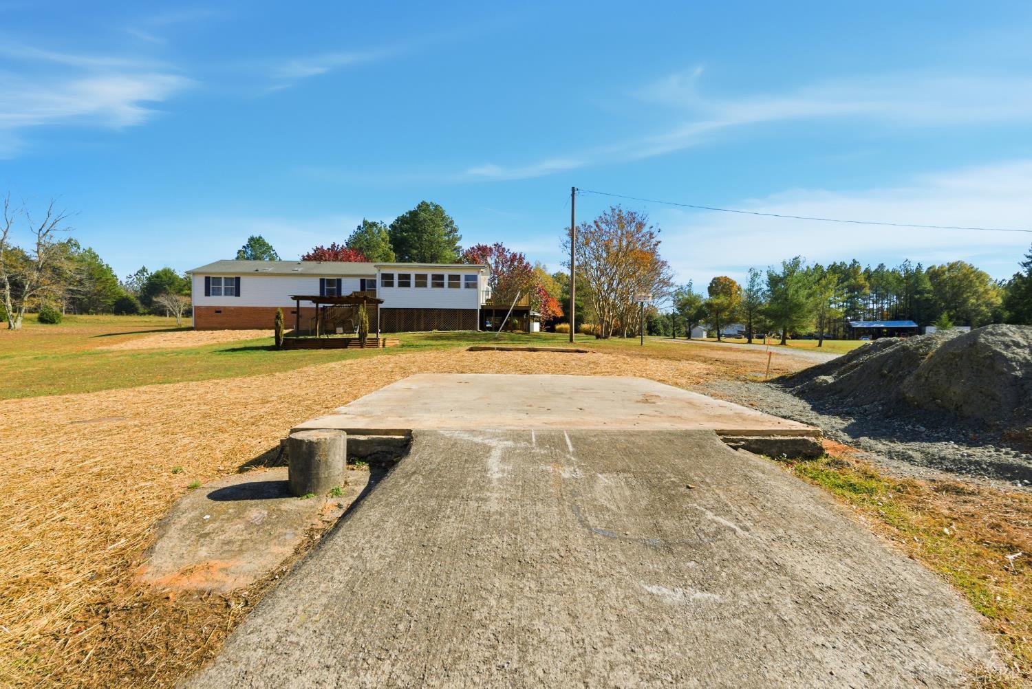 1821 Telegraph Road Gretna, VA 24557 - Photo 43 of 54 a view of a swimming pool with an outdoor space and seating area