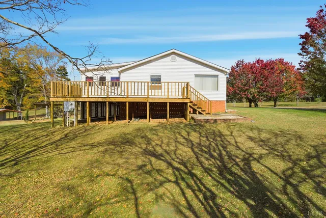 a view of balcony with wooden floor and fence