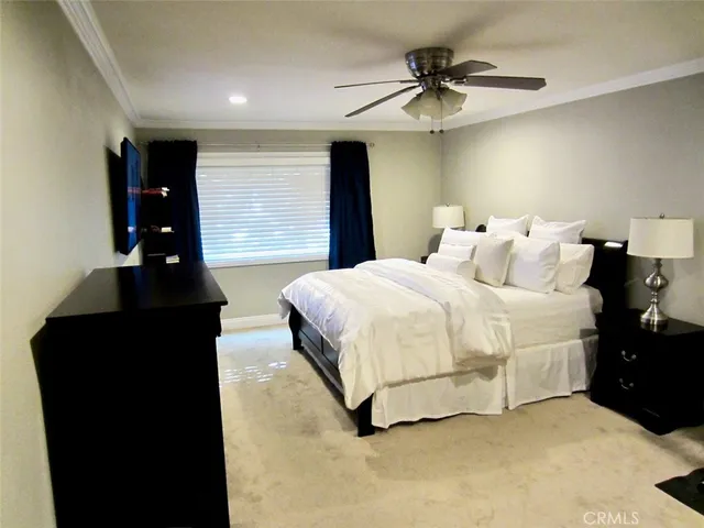 a bedroom with double bed and window