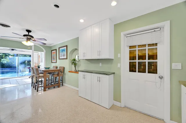 a bedroom with two beds and a window