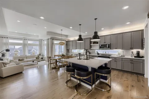 a kitchen with counter space dining table and chairs