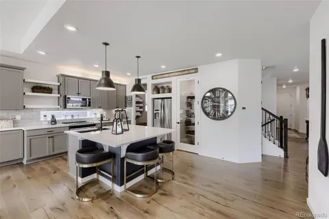 a view of a kitchen with a table and chairs