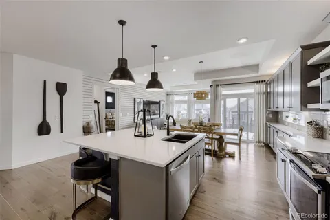 a kitchen with stainless steel appliances granite countertop a stove and a sink