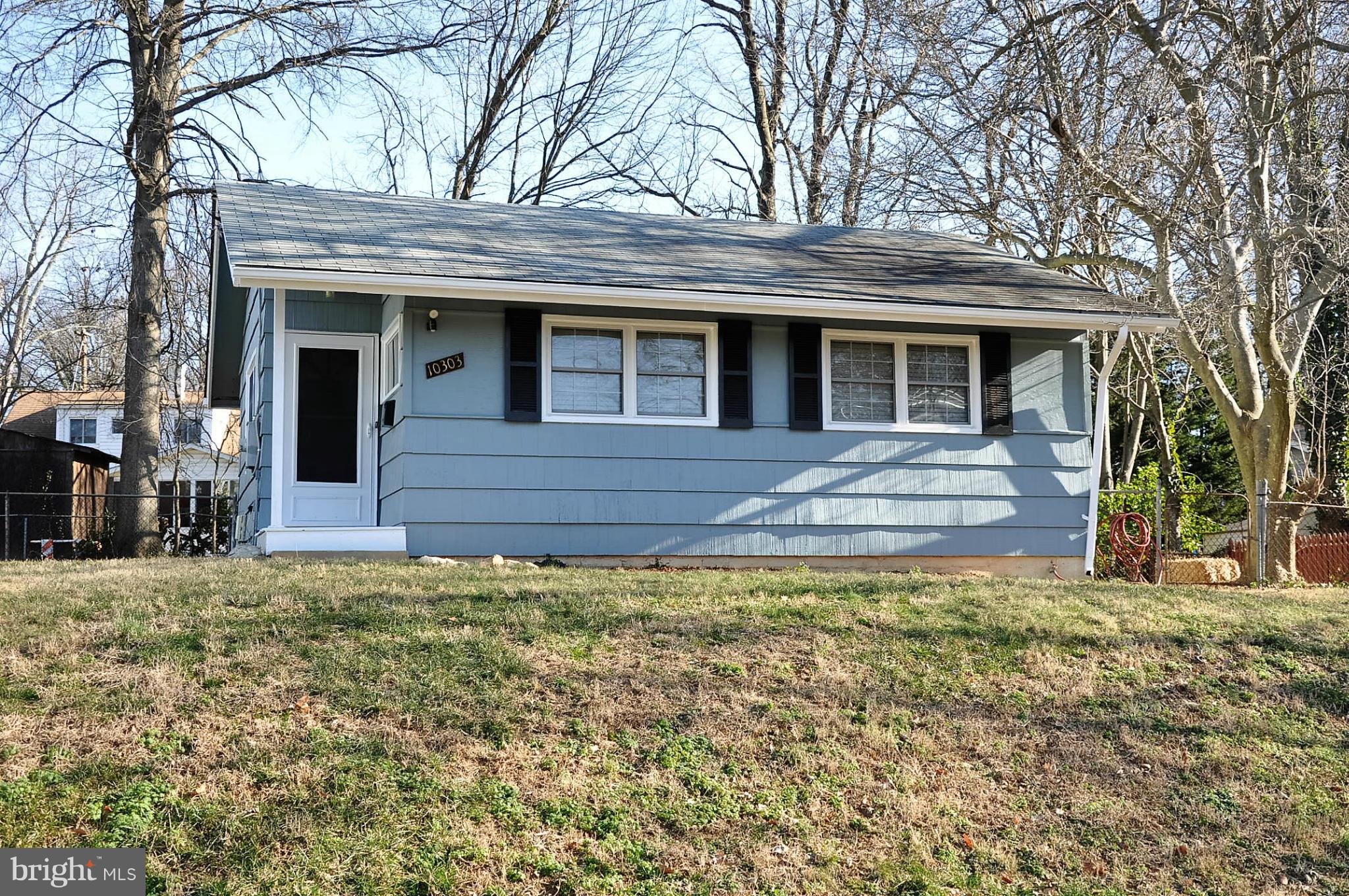 10303 Procter Street Silver Spring, MD 20901 - Photo 1 of 24 a view of a house with a yard
