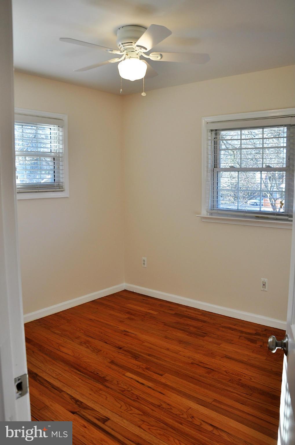 10303 Procter Street Silver Spring, MD 20901 - Photo 12 of 24 a view of empty room with wooden floor