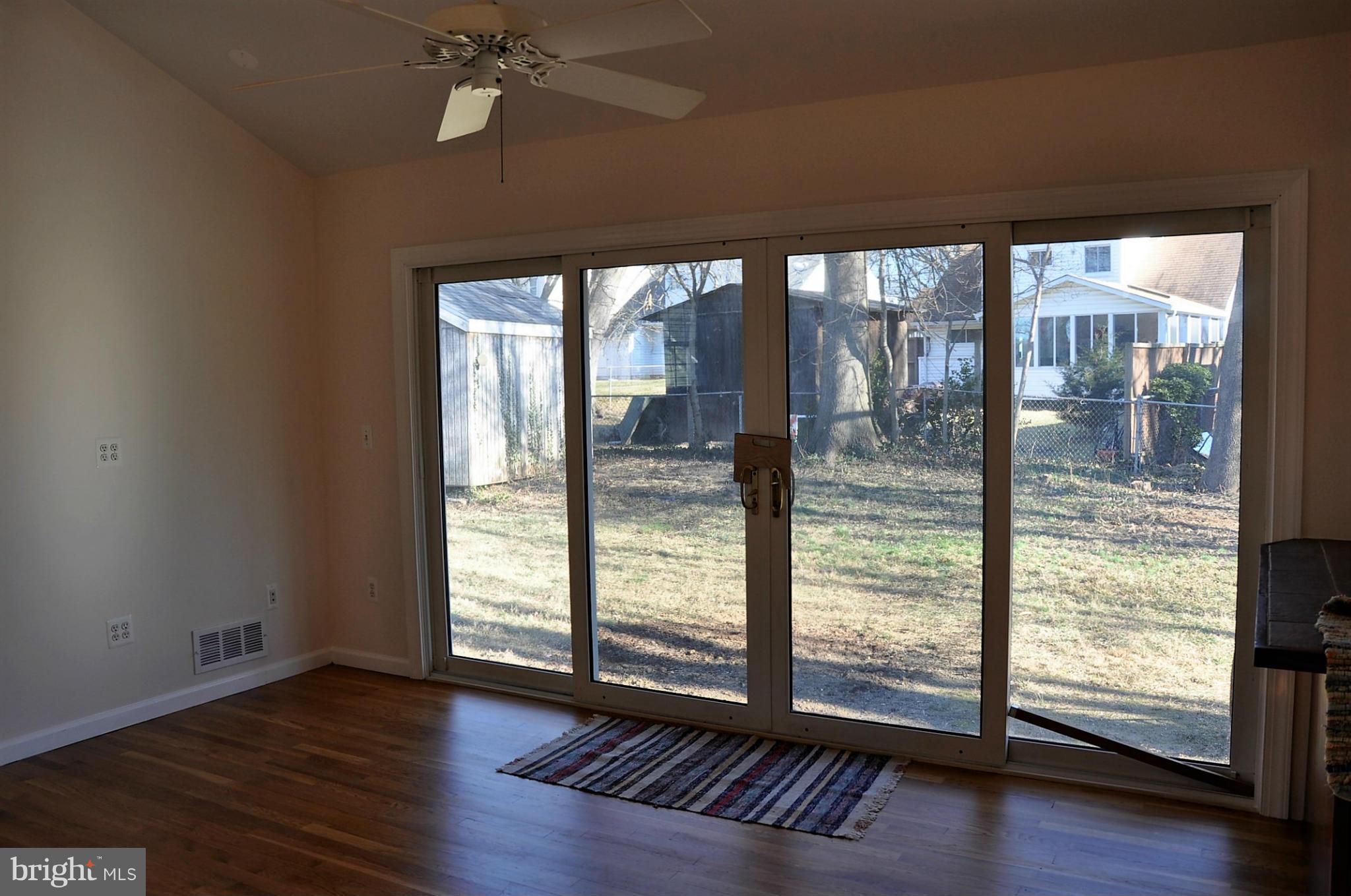 10303 Procter Street Silver Spring, MD 20901 - Photo 7 of 24 a view of a room with wooden floor and balcony