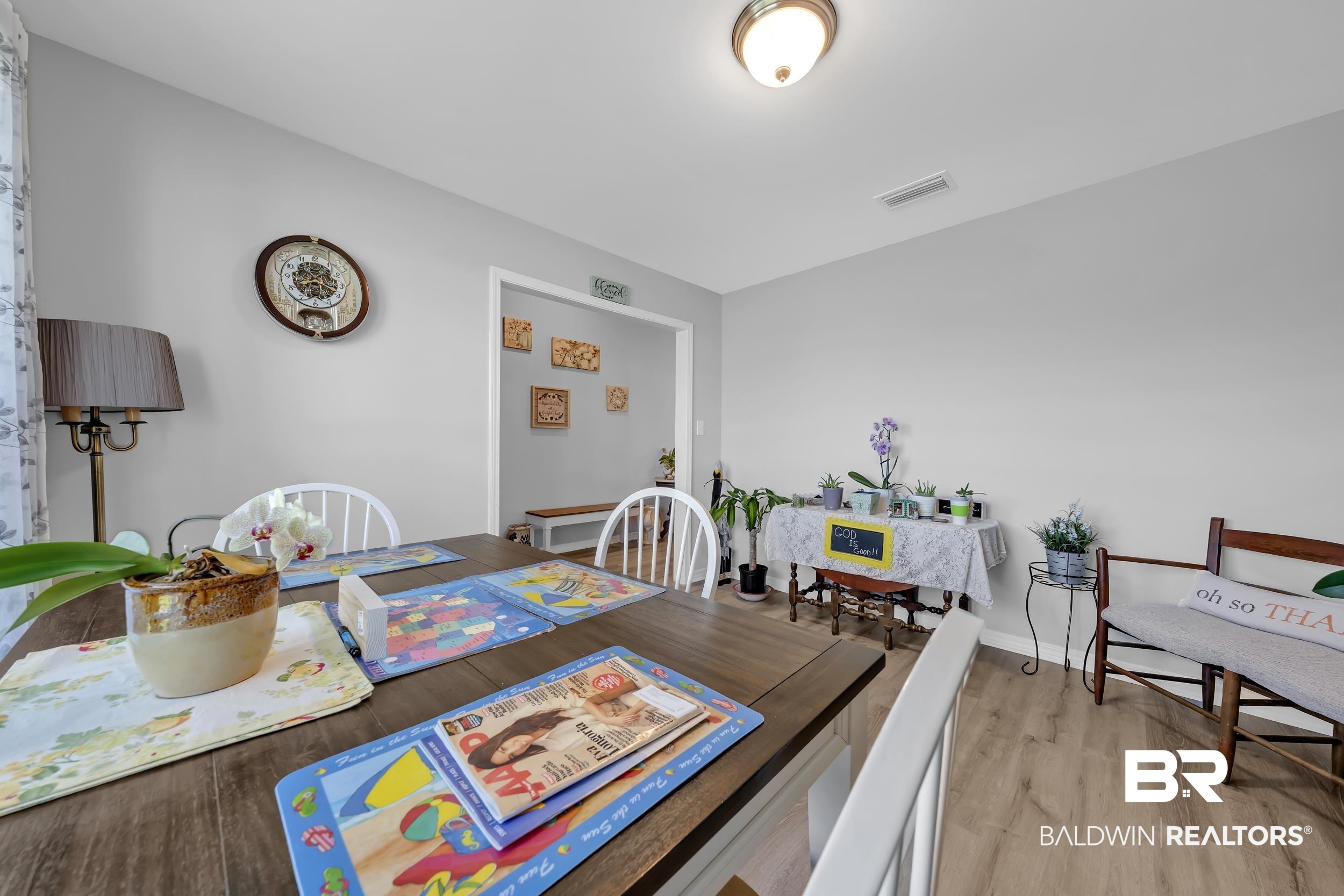 1228 Caper Avenue Foley, AL 36535 - Photo 17 of 54 Spacious dining area featuring wood-finish flooring, a neutral color palette, and a recessed ceiling light