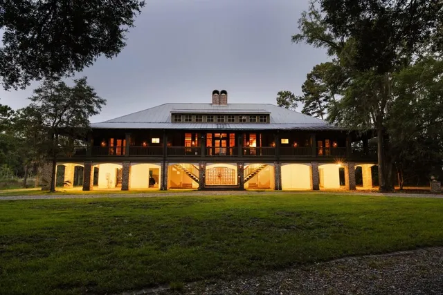 a view of a balcony with furniture and wooden floor