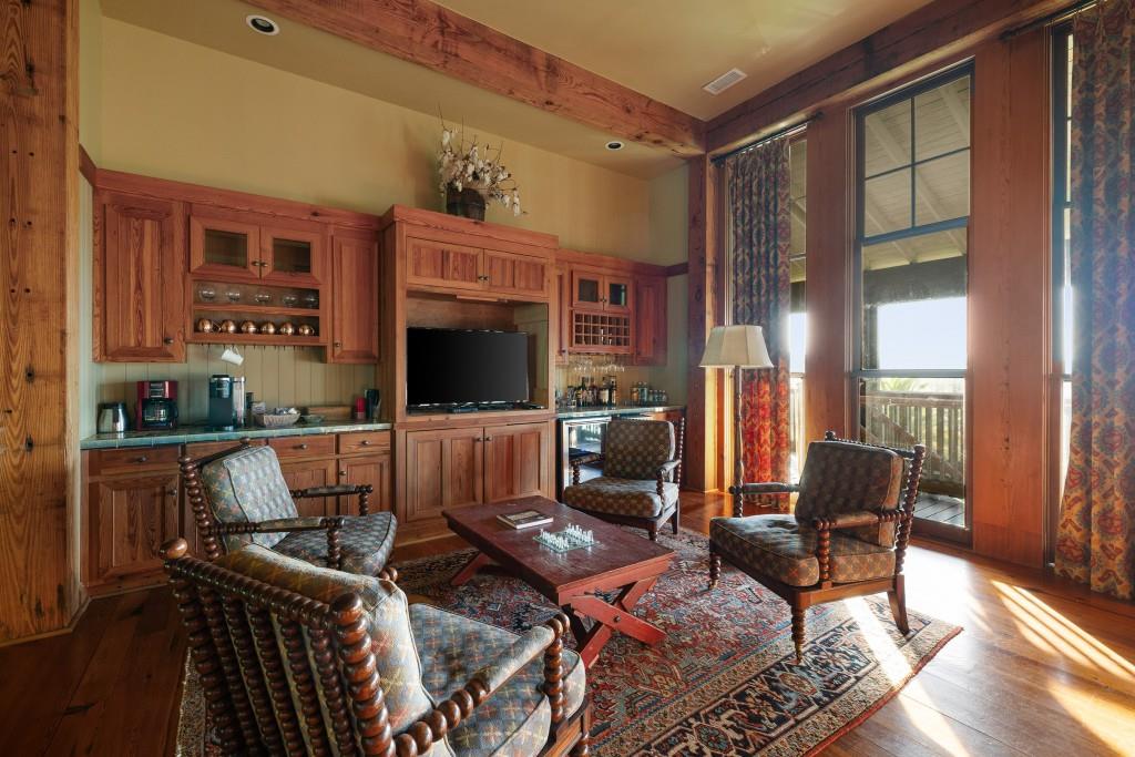 1300 Retreat Road Riceboro, GA 31323 - Photo 18 of 91 a living room with furniture a flat screen tv and a floor to ceiling window