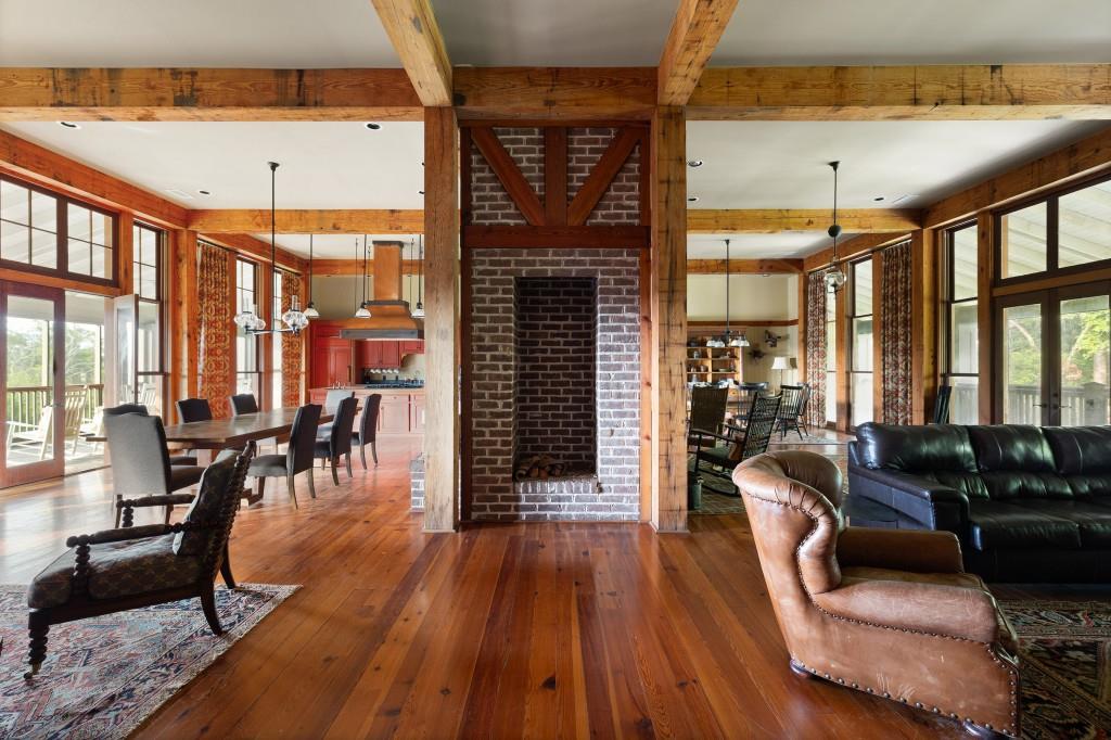 1300 Retreat Road Riceboro, GA 31323 - Photo 19 of 91 a living room with furniture a large window and wooden floor