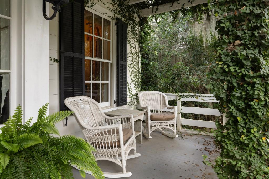 1300 Retreat Road Riceboro, GA 31323 - Photo 40 of 91 a view of a chairs and table in the back yard